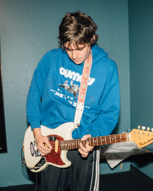 Otis wearing 'NOT NORMAL' HOODIE front