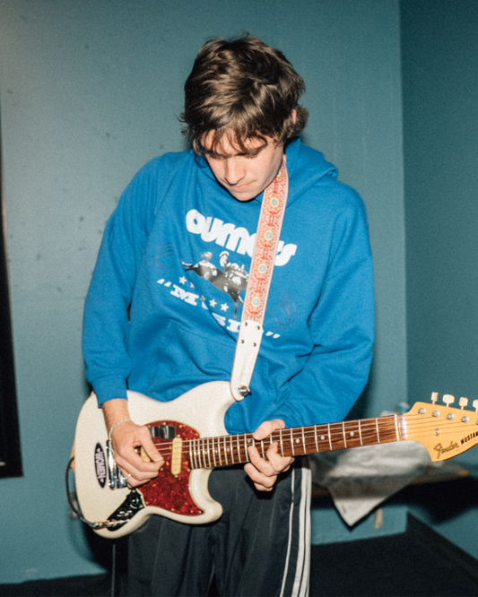 Otis wearing 'NOT NORMAL' HOODIE front